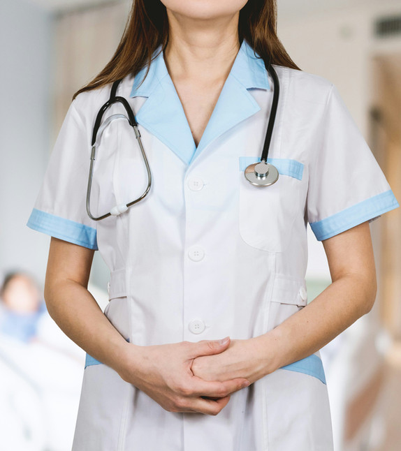 A healthcare worker at a desk