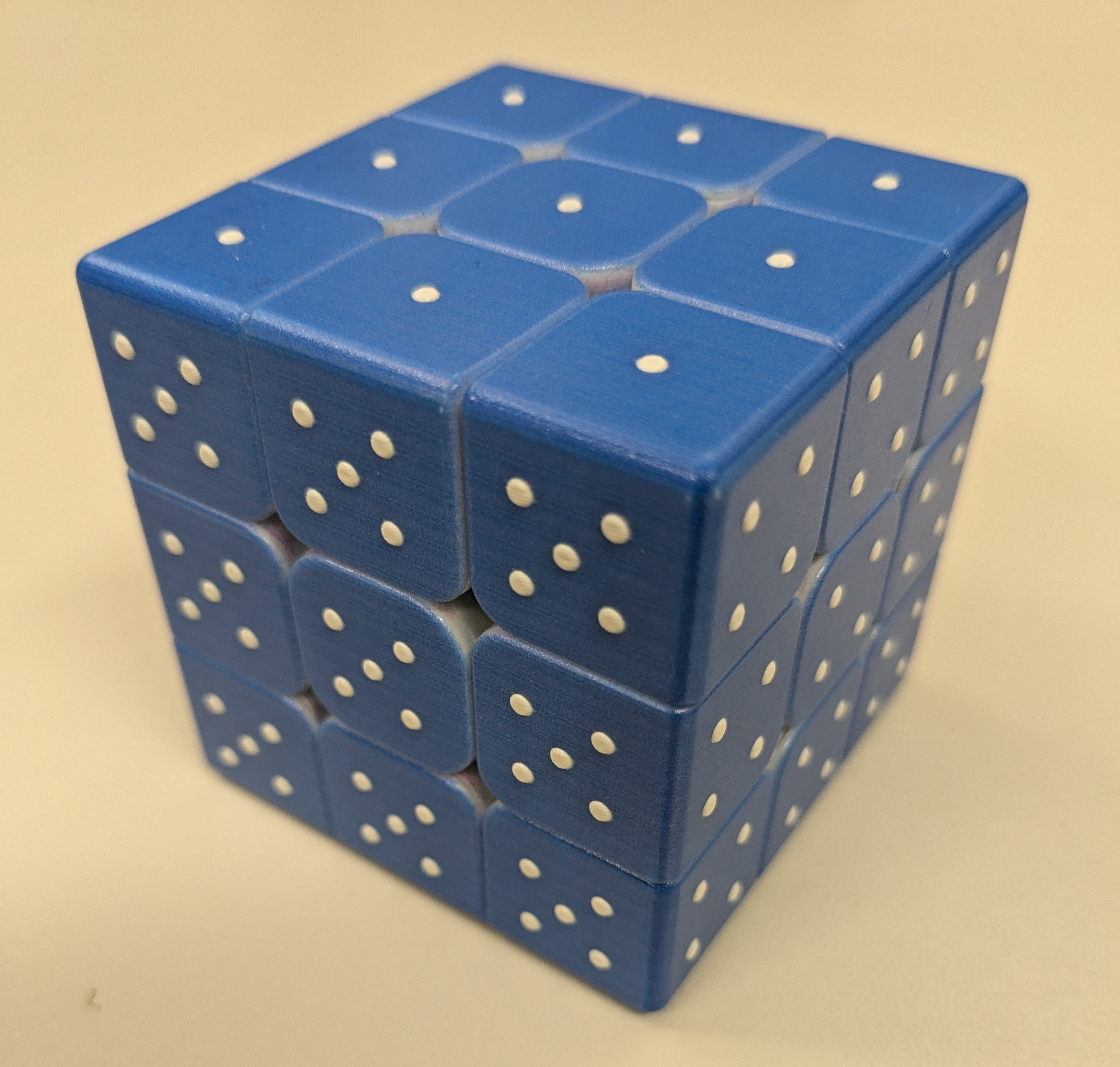 Photo of the Tactile Puzzle Cube from the ATRC lending library.