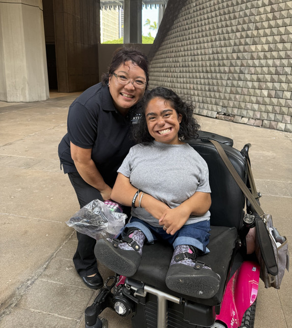 ATRC staff member with a client who uses a wheelchair